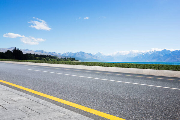 landscape of blue sea from empty road