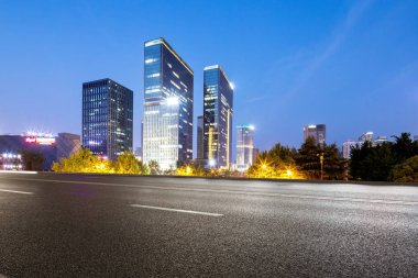 empty road with modern buildings clipart