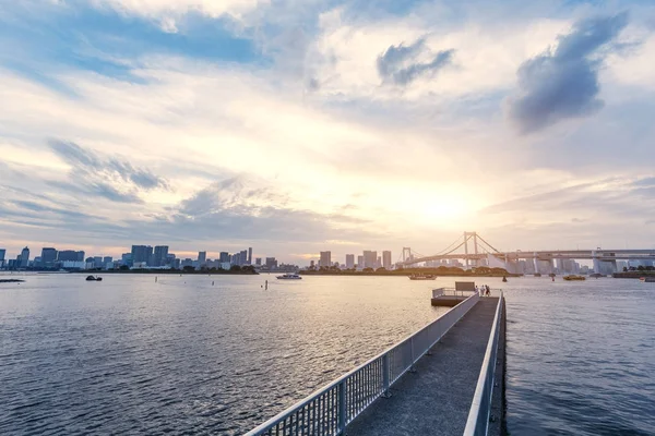 Empty fishing dock with city near river — Stock Photo, Image