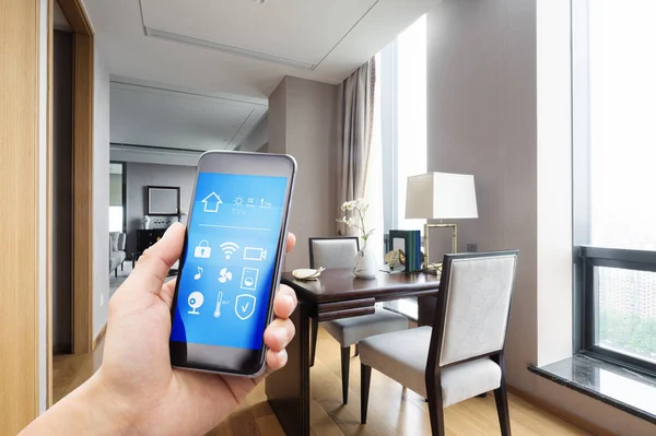Mobile phone with living room in smart home — Stock Photo, Image