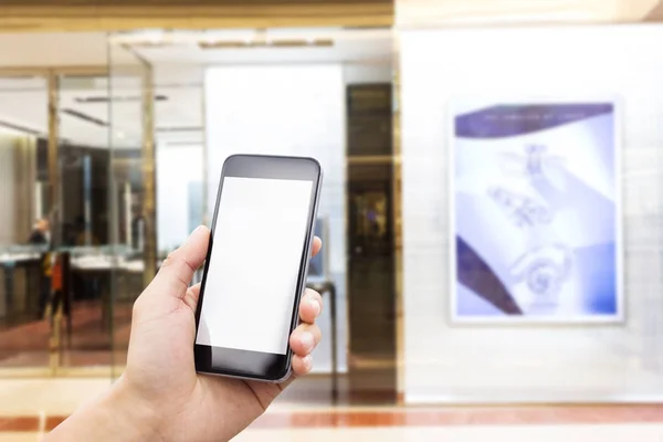 Teléfono móvil con interior del centro comercial — Foto de Stock