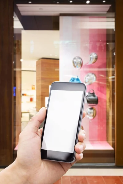 Teléfono móvil con interior del centro comercial — Foto de Stock