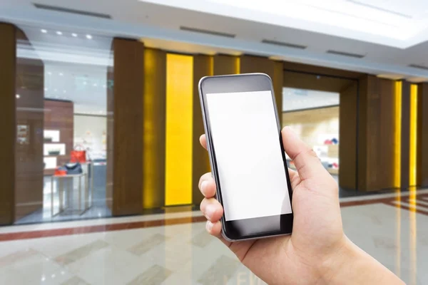 Teléfono móvil con interior del centro comercial — Foto de Stock