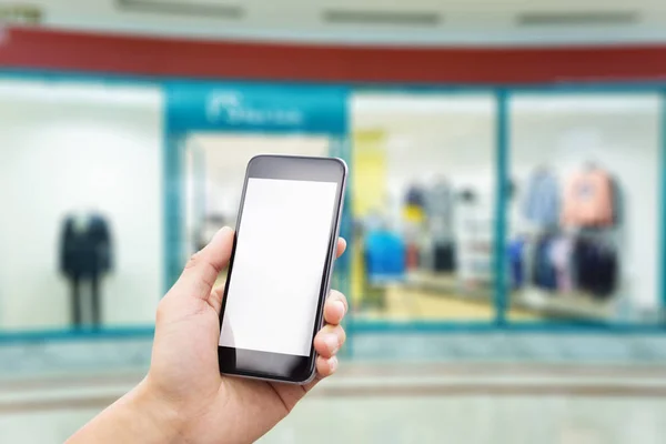 Teléfono móvil con interior del centro comercial — Foto de Stock