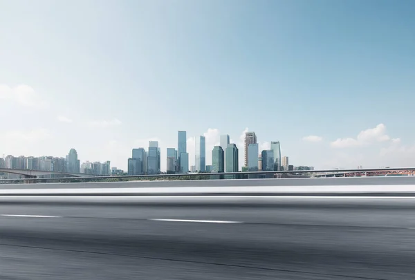 Asphalt road with cityscape of modern city — Stock Photo, Image