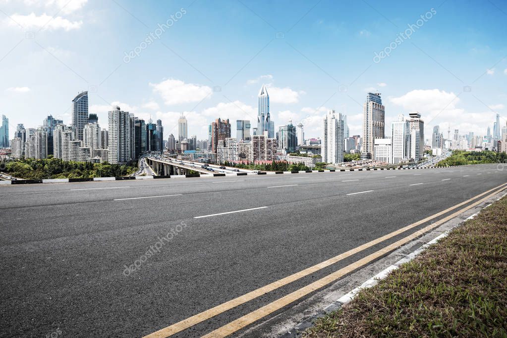 asphalt road with cityscape of modern city