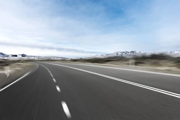 Empty asphalt road with snow mountains — Stock Photo, Image