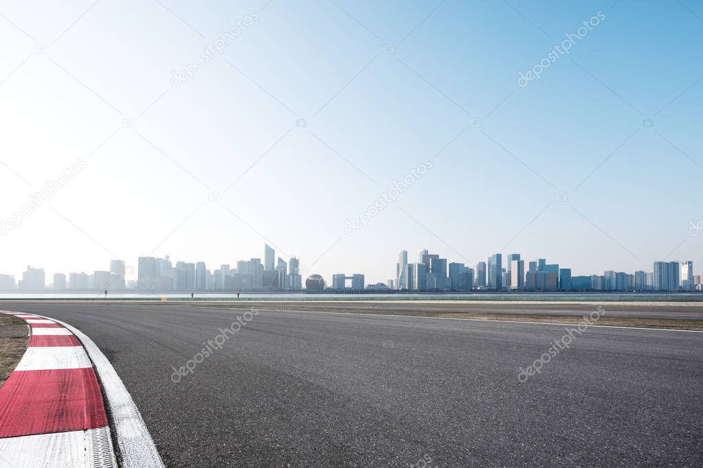 asphalt road with cityscape of modern city