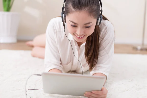 chinese woman listening music in room