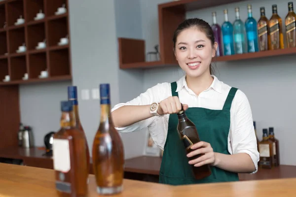 Young pretty woman works in cafe — Stock Photo, Image