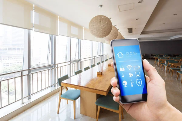 Smartphone in modern cafeteria — Stock Photo, Image