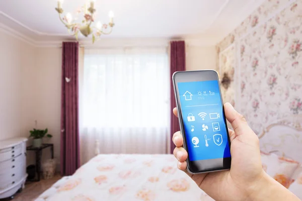 Smartphone in modern bedroom — Stock Photo, Image