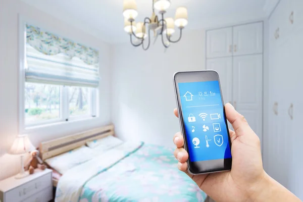 Smartphone in modern bedroom — Stock Photo, Image