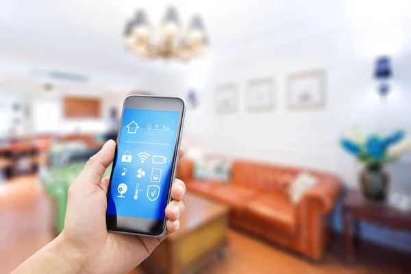 Mobile phone in modern living room — Stock Photo, Image