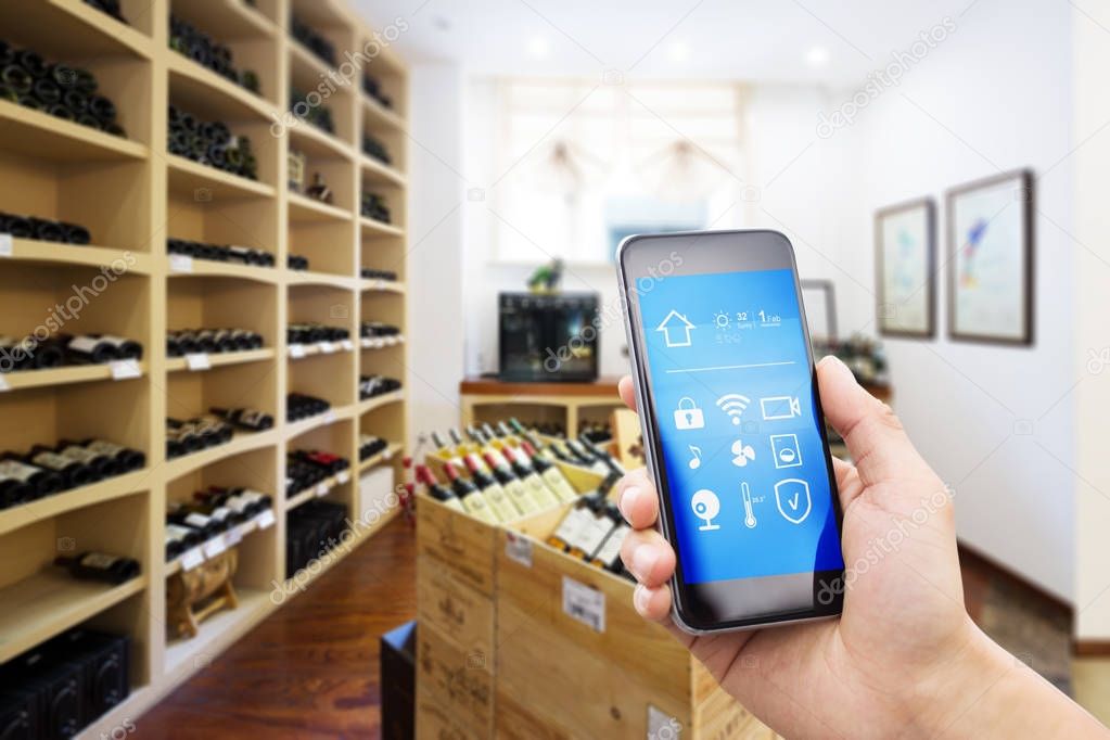 mobile phone in modern wine cellar