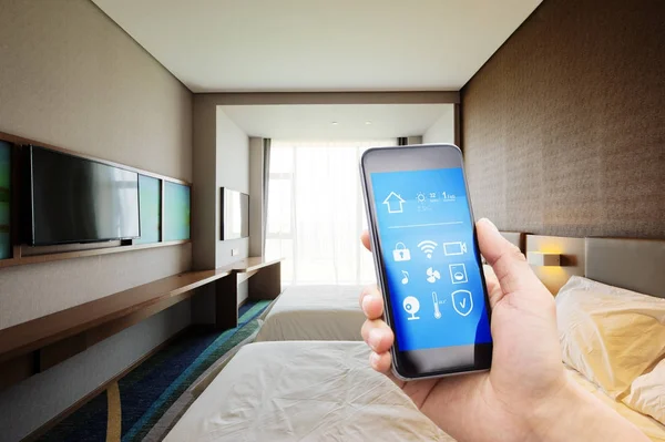 Smartphone in modern bedroom — Stock Photo, Image