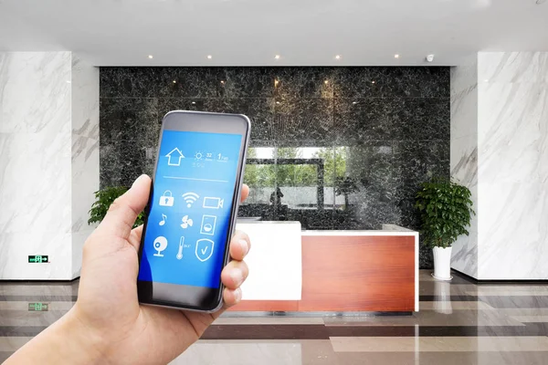 Smart phone in modern hallway — Stock Photo, Image