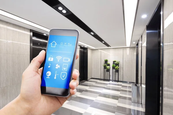 Smart phone in modern hallway — Stock Photo, Image