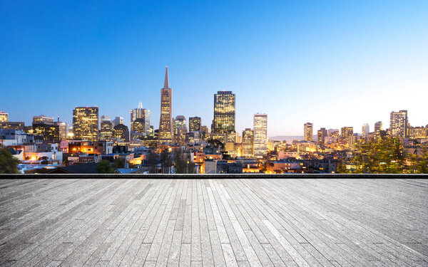 Empty brick floor and cityscape of San Francisco in blue cloud sky
