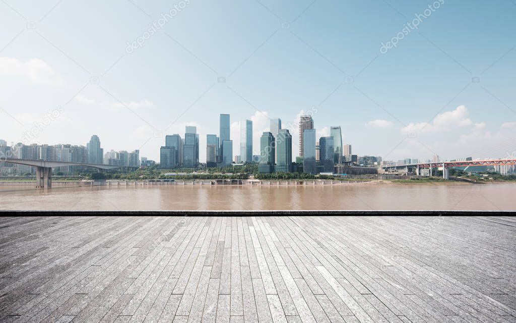 empty brick floor and cityscape of Chongqing in cloud sky