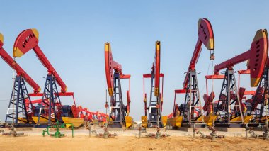 oilfield with many pump units clipart