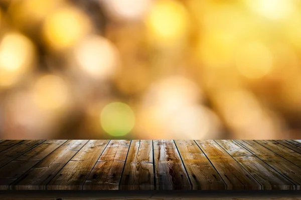 Goldener Bokeh-Hintergrund mit Tisch — Stockfoto