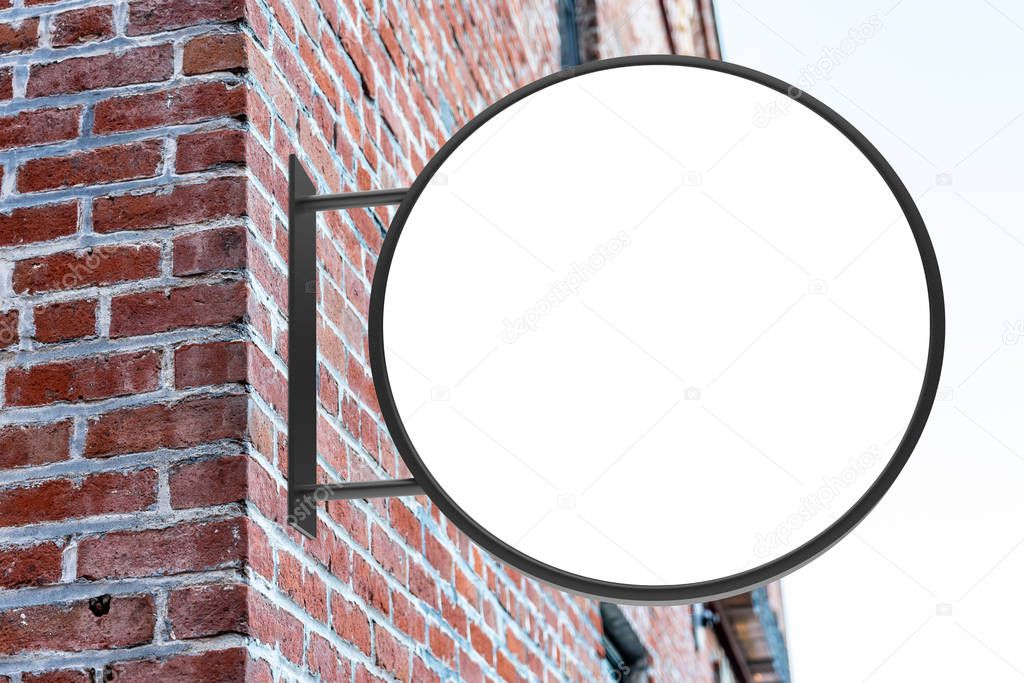 Round white company sign mockup on a brick wall