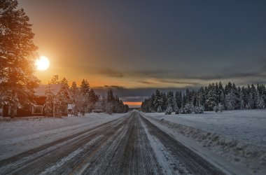 Sunset over road, Lapland Finland clipart