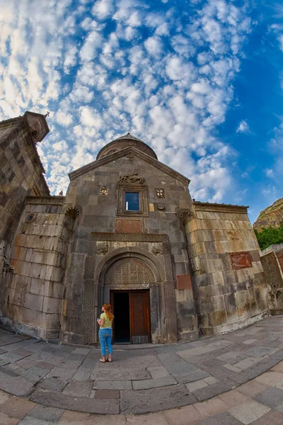 Young woman at Geghard Monastery of Armenia — Stock Photo, Image