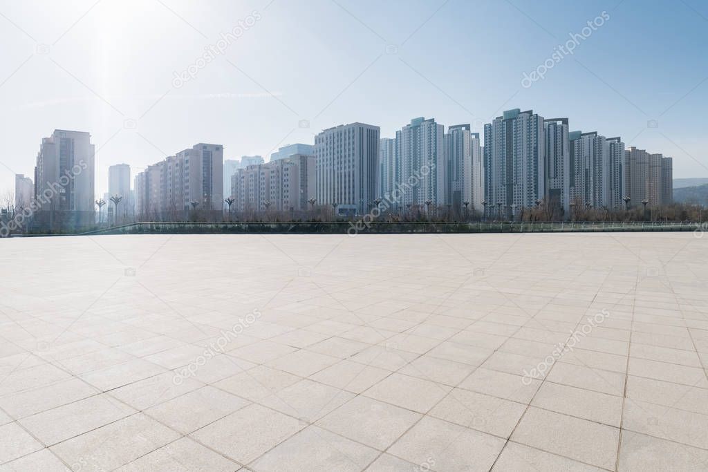 empty brick floor with cityscape