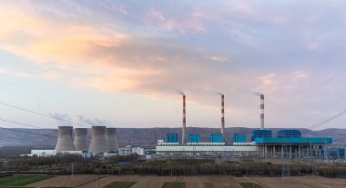 thermal power plant at dusk clipart