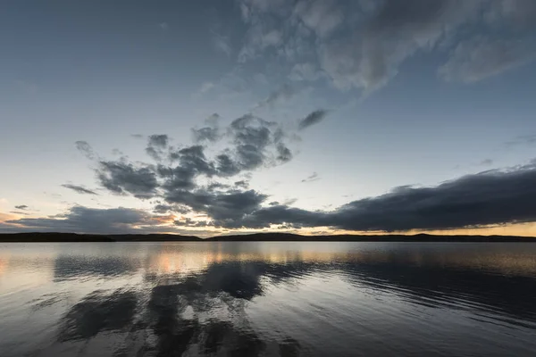 grey sky and plateau lake in sunset, madoi county, qinghai province, China.