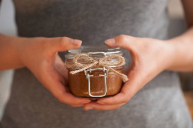 Holding a Jar of Nut Butter clipart