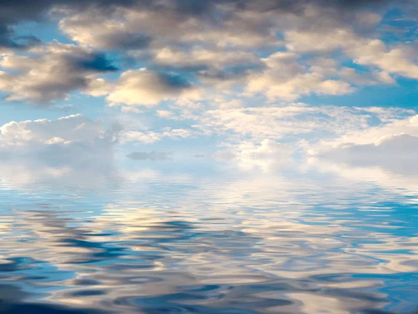 reflection of the Sunny sky in the calm surface of the sea