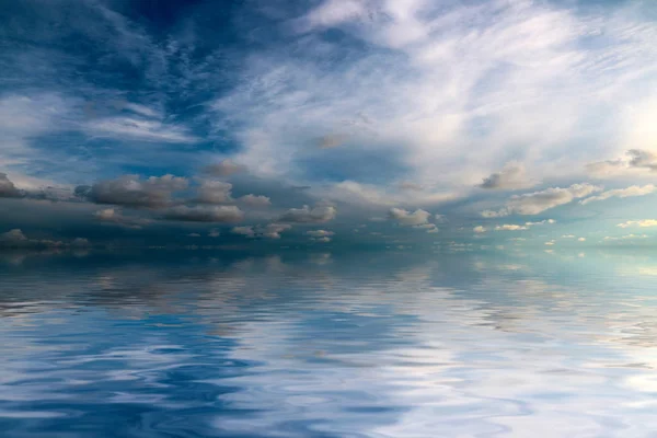 reflection of the Sunny sky in the calm surface of the sea