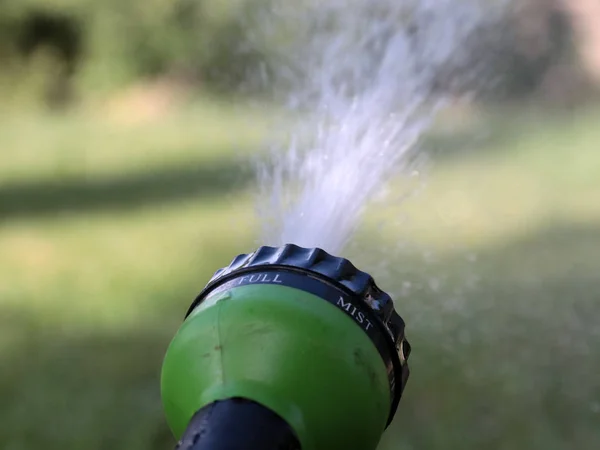 Stream Clean Water Flows Plastic Sprayer Watering Lawn — ストック写真