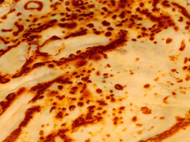 a beautiful butter pancake as a symbol of the Russian holiday Maslenitsa