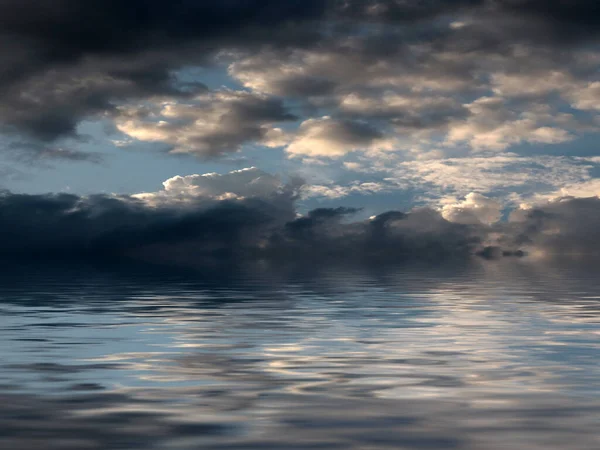 reflection of the cloudy sky in the calm water surface of the sea