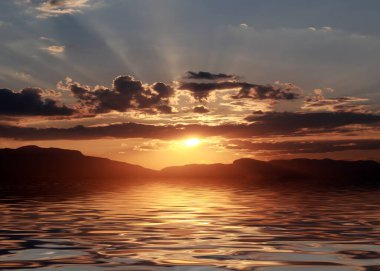 Gün batımında güneş ışınları ve sakin denizin yüzeyinde yansıma.