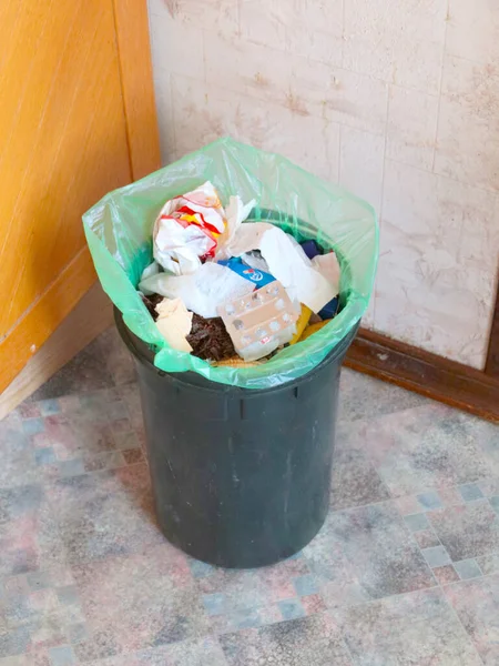 plastic bucket with food and household waste