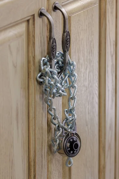 Vintage door locked with chain and padlock