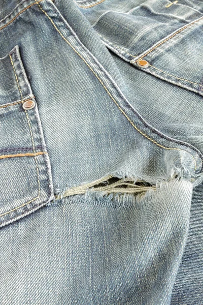 Torn jeans pants — Stock Photo, Image