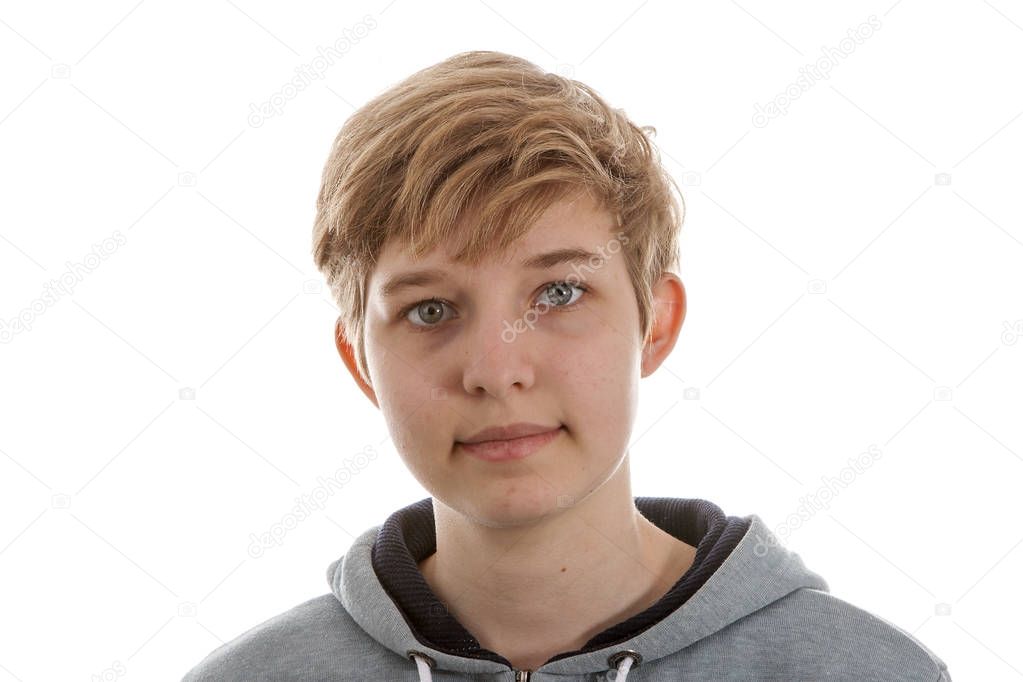 Teenage trangender boy posing over white background