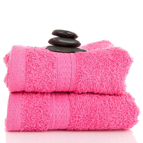 两条粉色毛巾 上面有黑色卵石 盖在白色背景上 — 图库照片