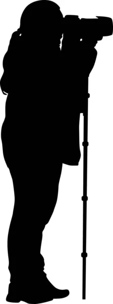 Photographer with monopod silhouette — Stock Vector