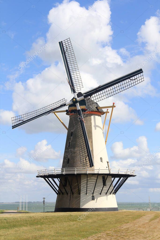 A beautiful old historic windmill, with four wings
