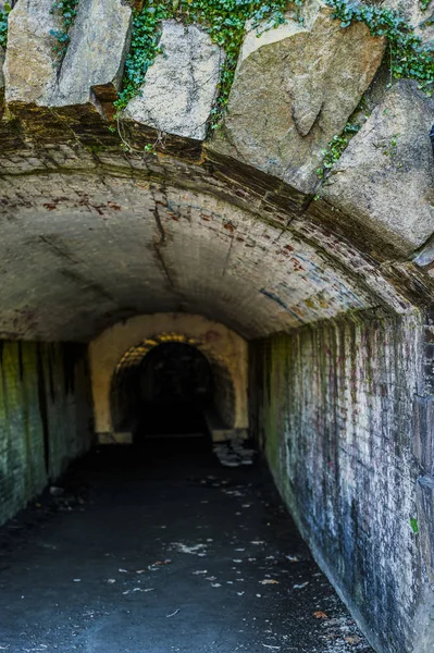 abandoned tunnel with brick walls