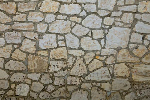 Detail of stone house as background