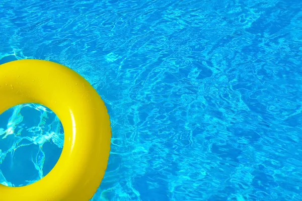 Inflatable tube floating in swimming pool