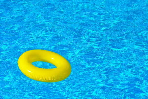 Colorful inflatable tube floating in swimming pool